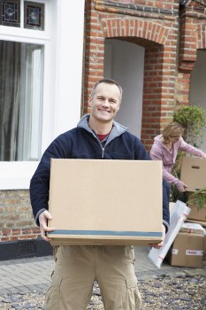 Removal team handling home furniture during a house move in Harrow
