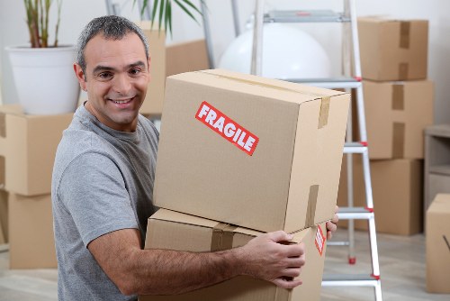 Removal company team handling household move in Harrow