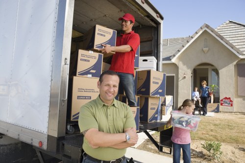 Local moving van helping with furniture and boxes in Harrow