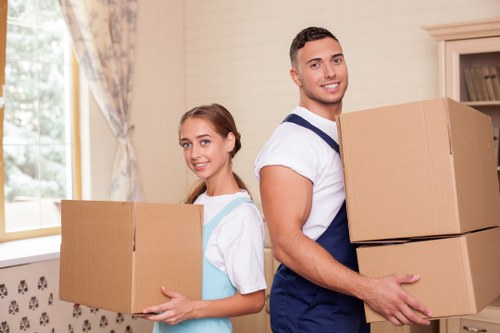 Man and van team transporting household items for a flat move