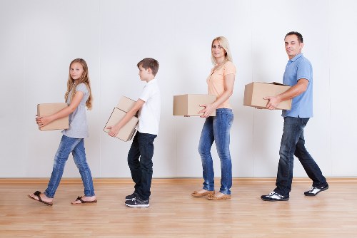 Packed moving boxes and household items ready for removals in Harrow